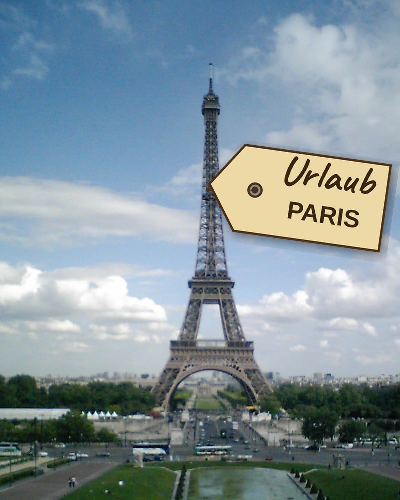 Foto des Eiffelturms mit der Bezeichnung 'Urlaub PARIS'.